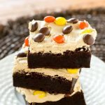 Homemade Reese's Chocolate Peanut Butter Brownies with thick, rich peanut butter frosting and Reese's Pieces. A special treat for chocolate and peanut butter lovers!