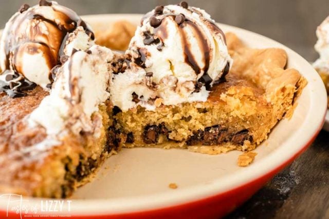 chocolate chip cookie pie with ice cream on top in a pie plate