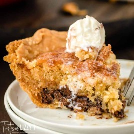 slice of cookie pie on a plate with ice cream