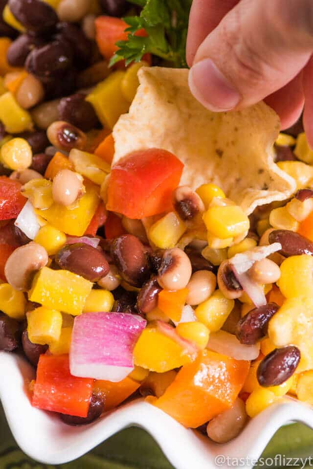 Hillbilly Caviar...an easy pepper, bean, onion, corn side dish that is served with tortilla chips. This is make-ahead recipe great for summer picnics!