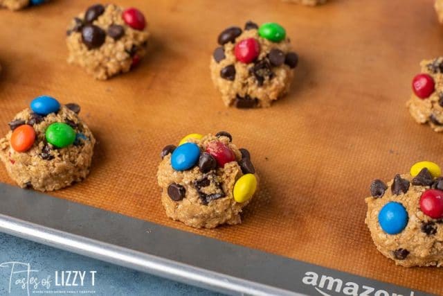 monster cookie dough balls on a baking mat