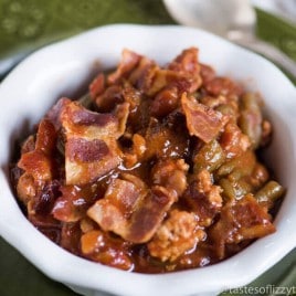 Throw this Slow Cooker Sausage Baked Bean Casserole together in the morning and forget it until your picnic. It's packed with bacon and 3 kinds of beans.