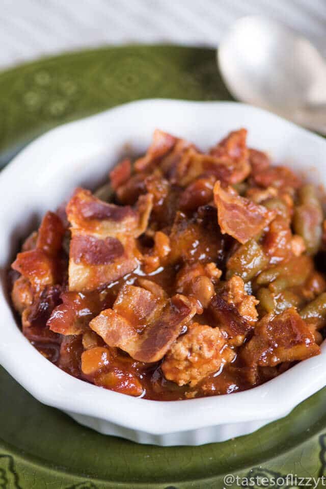Throw this Slow Cooker Sausage Baked Bean Casserole together in the morning and forget it until your picnic. It's packed with bacon and 3 kinds of beans.