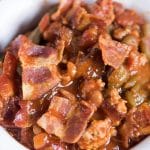 Throw this Slow Cooker Sausage Baked Bean Casserole together in the morning and forget it until your picnic. It's packed with bacon and 3 kinds of beans.