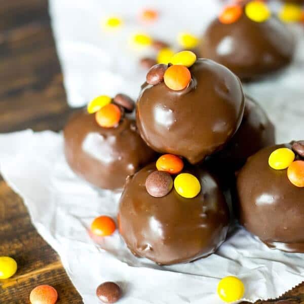 Reese's Peanut Butter Oreo Truffles. Oreos, cream cheese, Reese's Peanut Butter Cups and Reese's Pieces together in a bite-size, chocolate dipped treat.