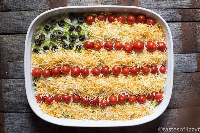 Bring this Patriotic Easy Layered Taco Dip to your next summer picnic! It’s a quick and easy side dish that you don’t have to bake. Serve with tortilla chips.
