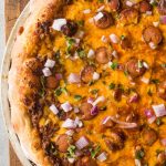 Take the classic chili cheese dog and twist it up with this Chili Cheese Pizza. Chili sauce, cheddar cheese, sliced hot dogs, and onion top a chewy pizza crust.