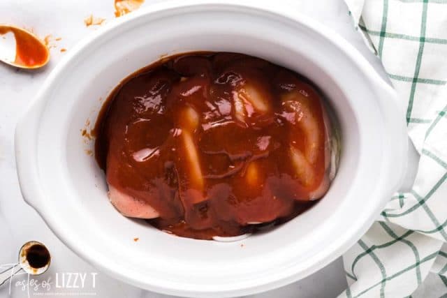 chicken breasts with bbq sauce in slow cooker