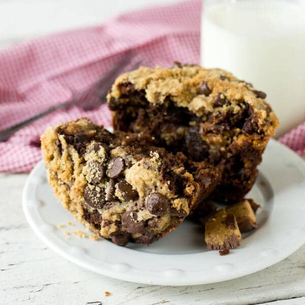 Soft, moist, fudgy bakery-style muffins are stuffed with Reese's peanut butter cups and a peanut butter streusel. These Reese's Chocolate Zucchini Muffins are the best way to eat zucchini!