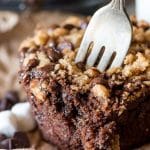 Soft, thick and rich s'more muffins are filled with chocolate, marshmallows and buttery graham cracker streusel. The secret to their moist texture is zucchini!