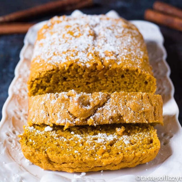 Easy pumpkin bread sliced with powdered sugar dusted on top