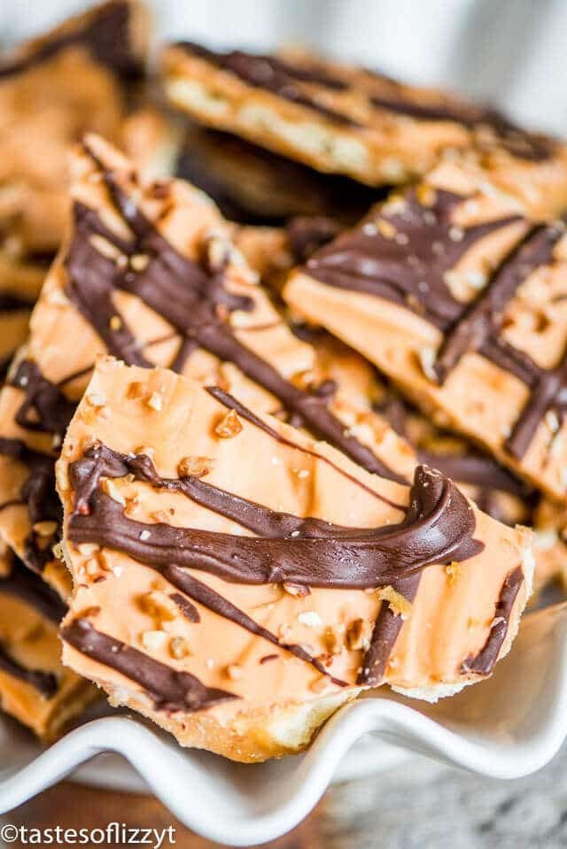 Pumpkin Spice Saltine Toffee uses Pumpkin Spice Hershey Kisses to give a perfect fall flavor to your favorite holiday candy recipe.