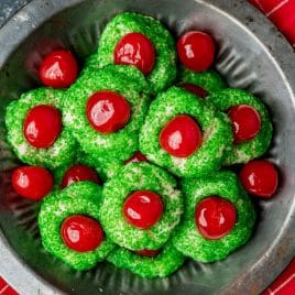 red and green grinch cookies in a pan