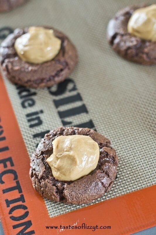 These cookies combine the best of both worlds...brownies and buckeyes! If you love buckeyes, but don't like taking the time to dip them in chocolate, you'll love this easy cookie recipe!