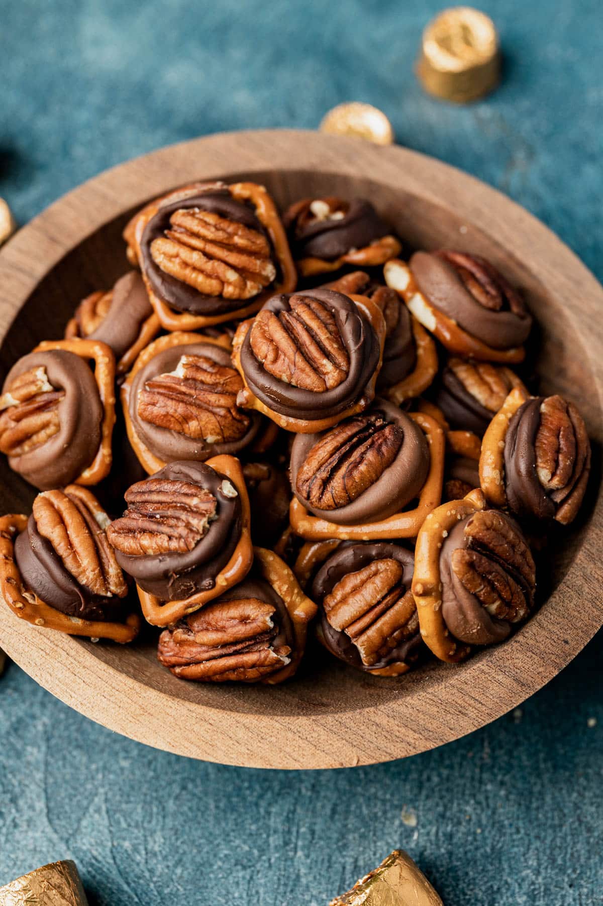 a bowl of caramel pecan pretzel turtles