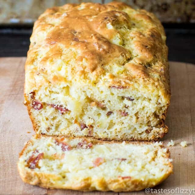 loaf of banana pineapple bread with one slice cut