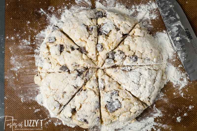 unbaked cinnamon scones on pastry mat