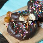 Chocolate Covered Caramel Sourdough Pretzels with bite out of it