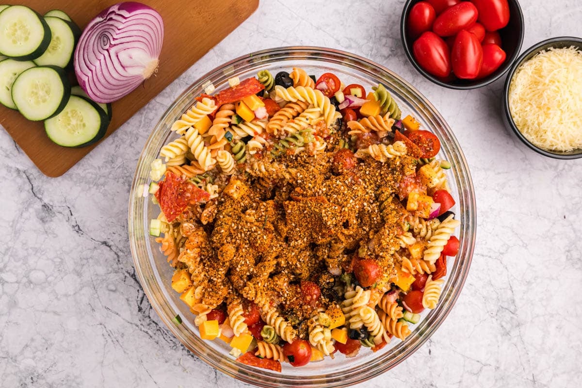 pasta salad seasoning sprinkled over pasta salad