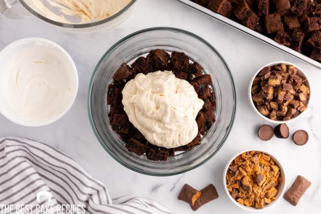 trifle dish with cake and peanut butter whipped cream