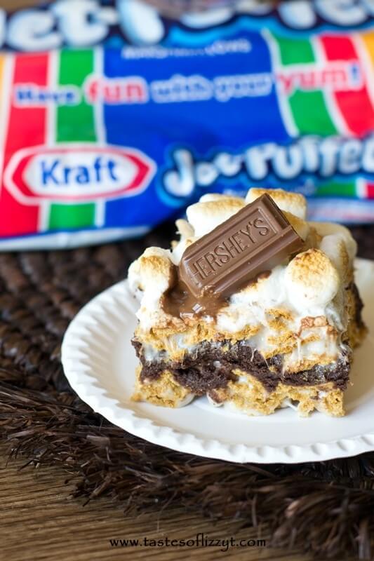 S'more Brownie Batter Bars. Gooey bars with brownie batter sandwiched between marshmallow covered golden grahams and toasted marshmallows on top!