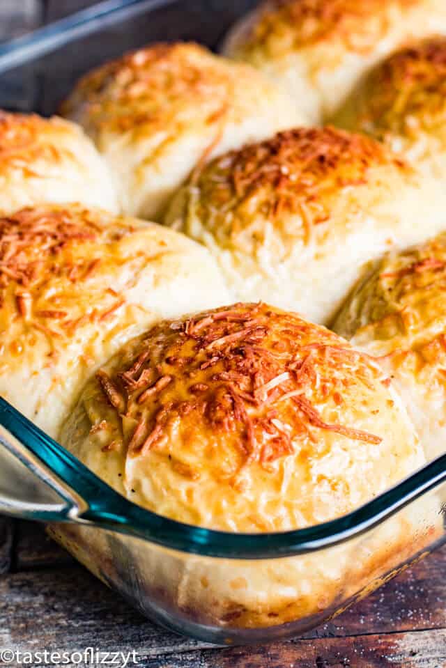 cheesy dinner rolls in a baking pan