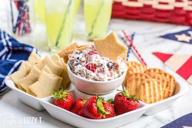 platter with strawberries, cookies and triple berry fruit dip