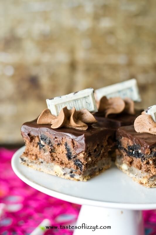 Cookies 'n Cream Cheesecake Bars. Chocolate cheesecake with a Hershey's Cookies 'n Cream cookie crust and Oreos inside