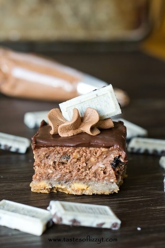 Cookies 'n Cream Cheesecake Bars. Chocolate cheesecake with a Hershey's Cookies 'n Cream cookie crust and Oreos inside