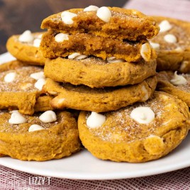 plate of pumpkin cookies, one broken in half