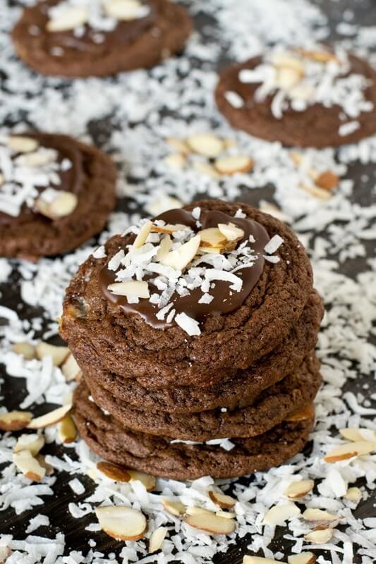 Bake these Almond Joy Chocolate Cookies for the coconut lover in your life. The cookies are fudgy with chopped Mounds bars inside and chocolate, coconut and almonds on top.