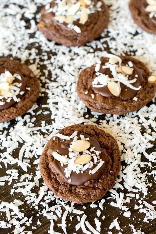 Bake these Almond Joy Chocolate Cookies for the coconut lover in your life. The cookies are fudgy with chopped Mounds bars inside and chocolate, coconut and almonds on top.