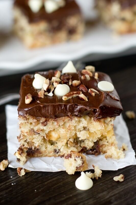 Cookie batter cake is full of white chocolate, semi-sweet chocolate chips, nuts and topped with chocolate frosting. Kids and adults will love this Chocolate Chip Cookie Cake!