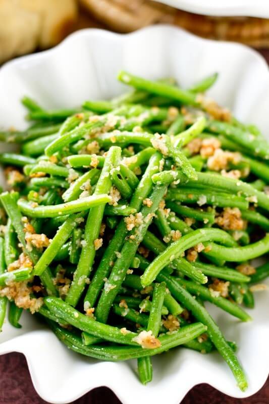 The simplest, most delicious way to eat green beans! These Italian Green Beans are sauteed in butter, bread crumbs and parmesan cheese. 