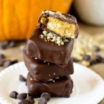 chocolate covered pumpkin pie bites with a bite out of one
