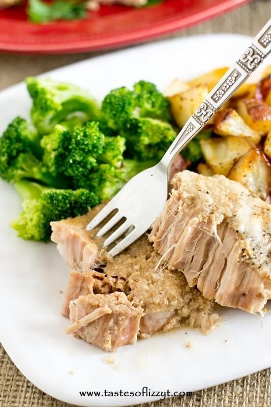 fork grabbing a bite of paleo slow cooker pork chops