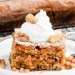 carrot walnut cake with whipped cream and nuts