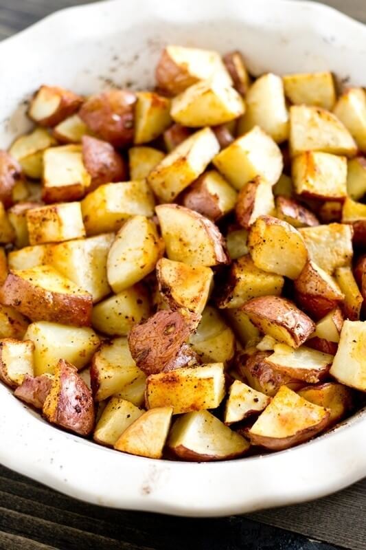 Simply seasoned, easy oven roasted potatoes make the ideal side dish for a meat and potatoes dinner. A high baking temperature makes the potatoes sizzle and brown nicely.