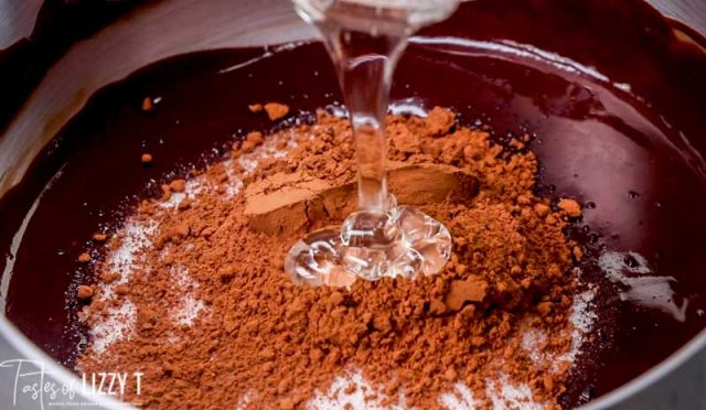 corn syrup pouring into cocoa powder