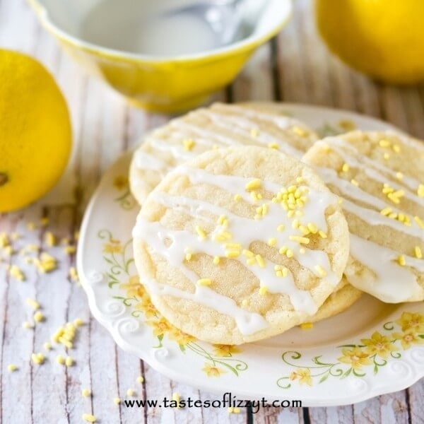 Lemon Sugar Cookies by Tastes of Lizzy T. Light, tangy, crisp on the outside, chewy on the inside, soft sugar cookies with a lemon glaze drizzle. Better than a bakery!