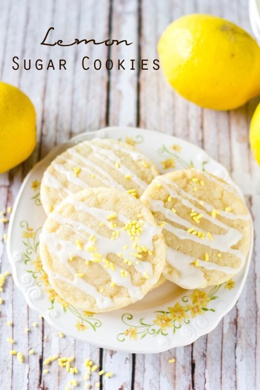Lemon Sugar Cookies by Tastes of Lizzy T. Light, tangy, crisp on the outside, chewy on the inside, soft sugar cookies with a lemon glaze drizzle. Better than a bakery!