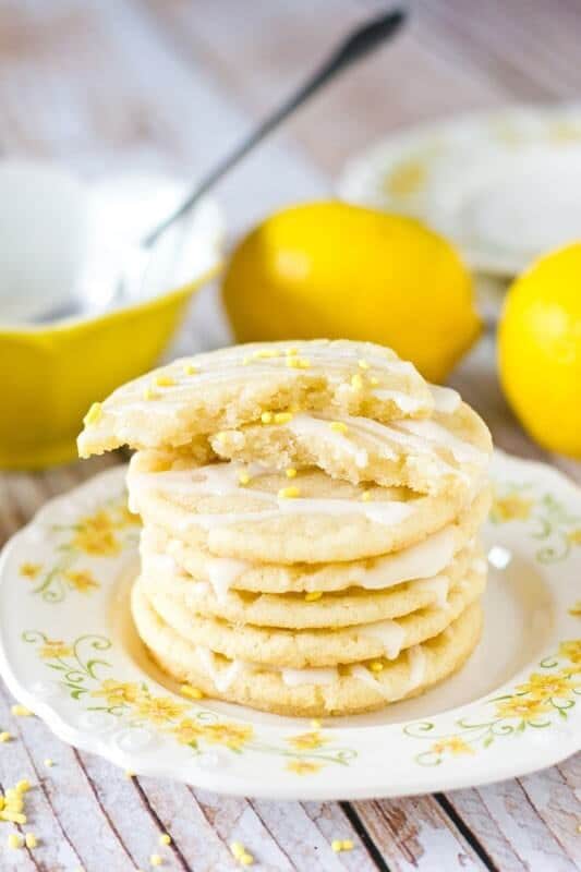 Lemon Sugar Cookies by Tastes of Lizzy T. Light, tangy, crisp on the outside, chewy on the inside, soft sugar cookies with a lemon glaze drizzle. Better than a bakery!