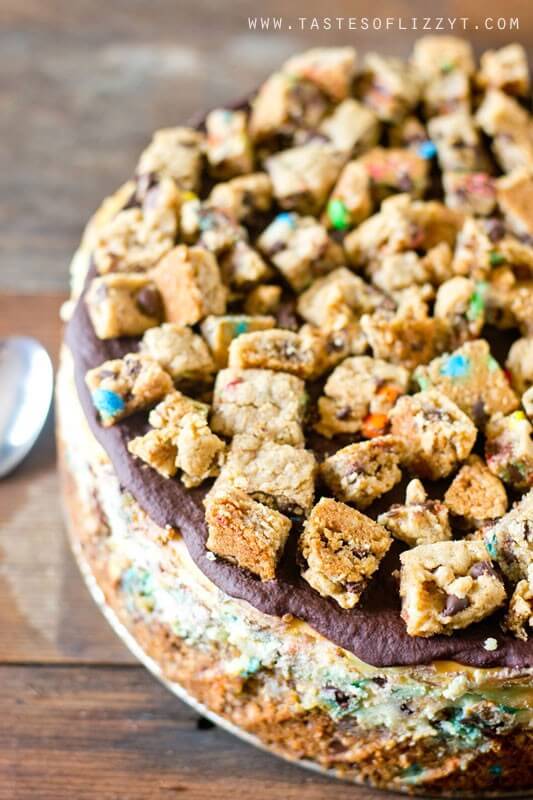 Your favorite cookie meets creamy cheesecake! This Monster Cookie Cheesecake will be a hit with cookie and cheesecake lovers alike. Cookie crust with M&M's swired throughout and a chocolate ganache topping.