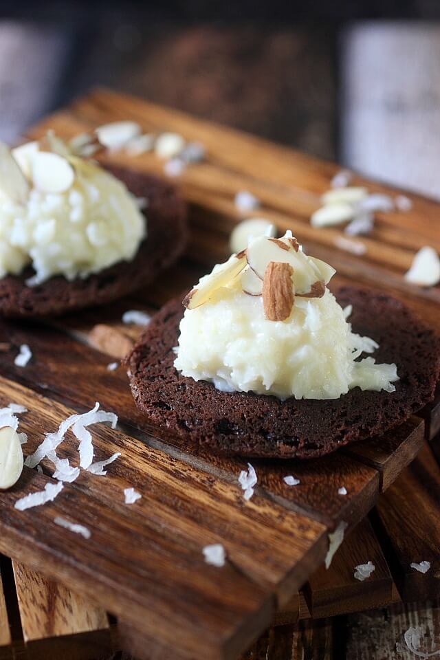 A Sweet coconut and almond filling is sandwiched between two soft baked brownie cookies. If there is ever a cookie you need to try – These Almond Joy Brownie Sandwich Cookies are the one!