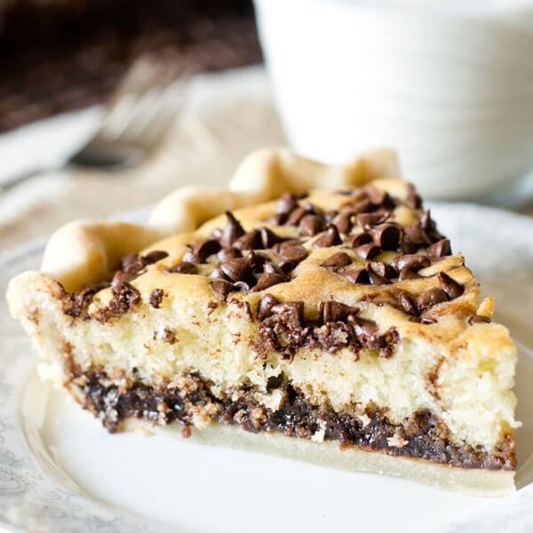 Chocolate Chip Funny Cake Pie is an old recipe that has timeless appeal. Chocolate fudge is topped with a soft, buttery cake and bakes inside a pie shell. Top with ice cream for a delicious pie a la mode.