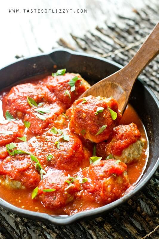 cast iron skillet full of hearty and healthy chicken Parmesan meatballs