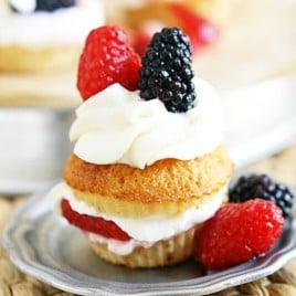 Sweet honey cornbread cupcakes turned into the best shortcakes you will ever have. Triple sugared berries piled high with fluffy clouds of homemade whipped cream. Summer was always meant to be this sweet.