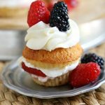 Sweet honey cornbread cupcakes turned into the best shortcakes you will ever have. Triple sugared berries piled high with fluffy clouds of homemade whipped cream. Summer was always meant to be this sweet.