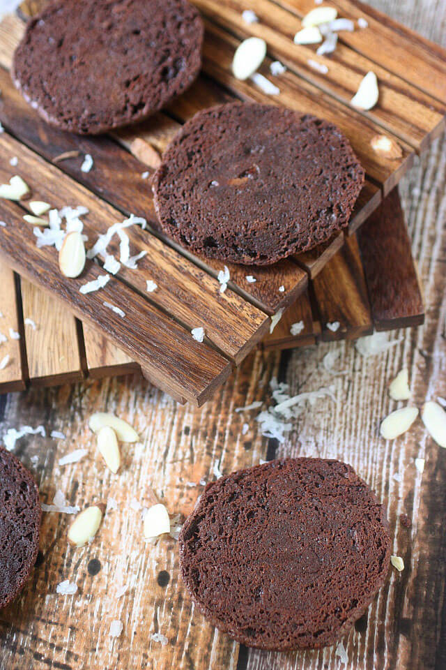A Sweet coconut and almond filling is sandwiched between two soft baked brownie cookies. If there is ever a cookie you need to try – These Almond Joy Brownie Sandwich Cookies are the one!