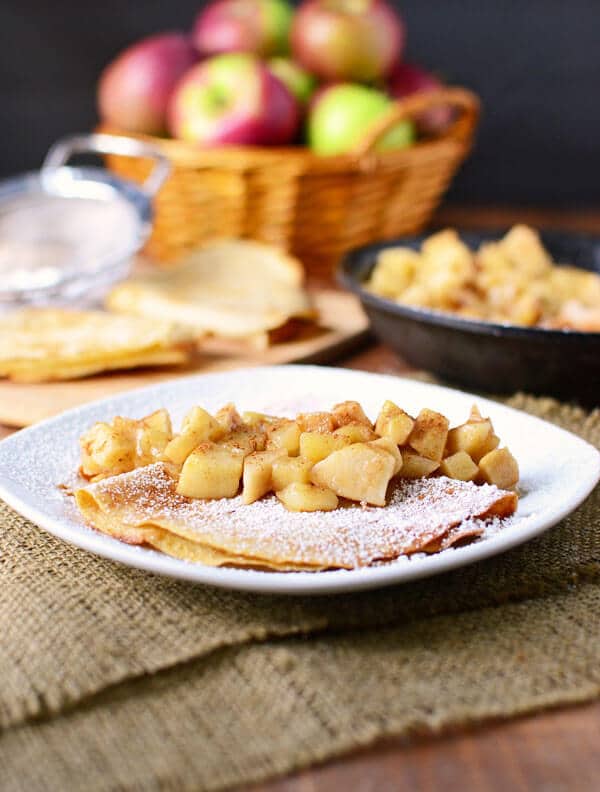 Whole wheat apple crepes stuffed with vanilla yogurt crepe filling and topped with cinnamon apples